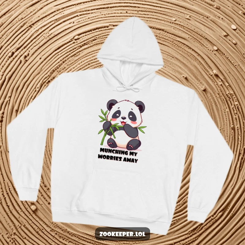 Funny hoodie illustrating a contented panda happily munching bamboo offered by a keeper, offering warmth and a peaceful scene.