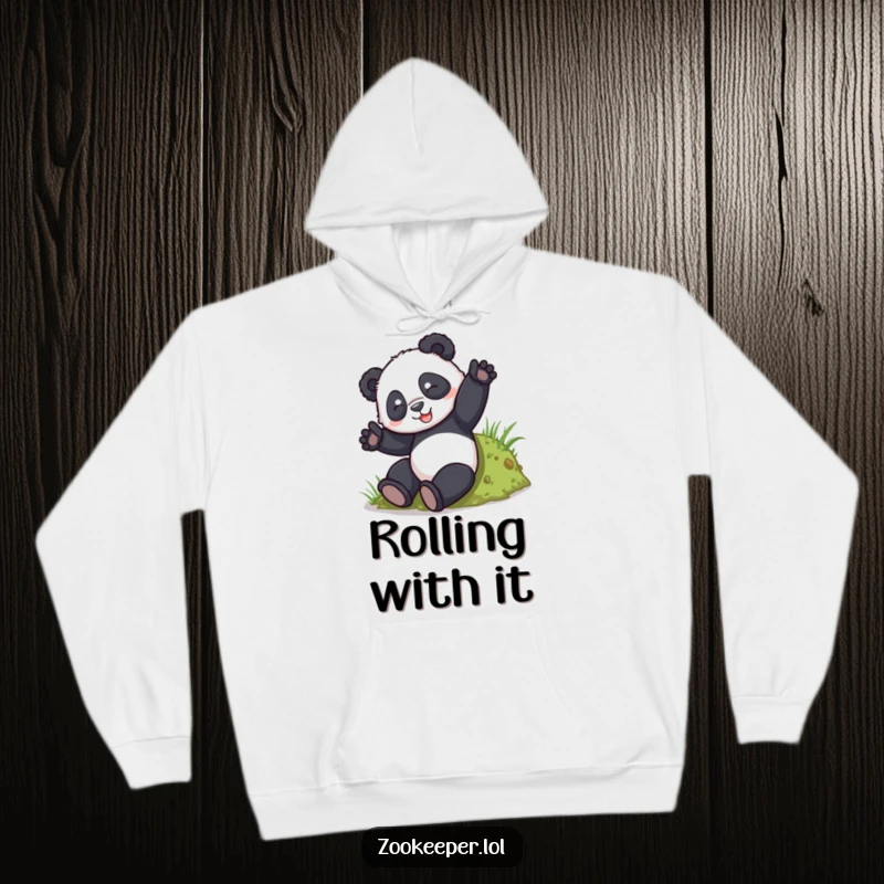 Funny Panda Tumble Hoodie: A playful panda tumbles down a small grassy hill, radiating carefree happiness.